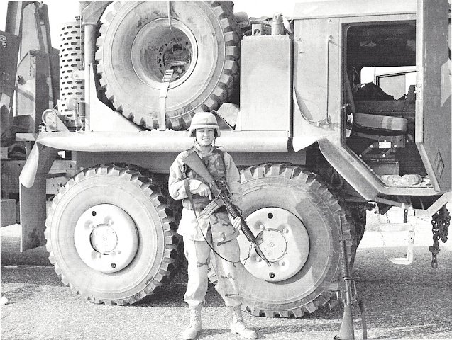 My Daughter in-law in Iraq next to her Convoy Truck v1